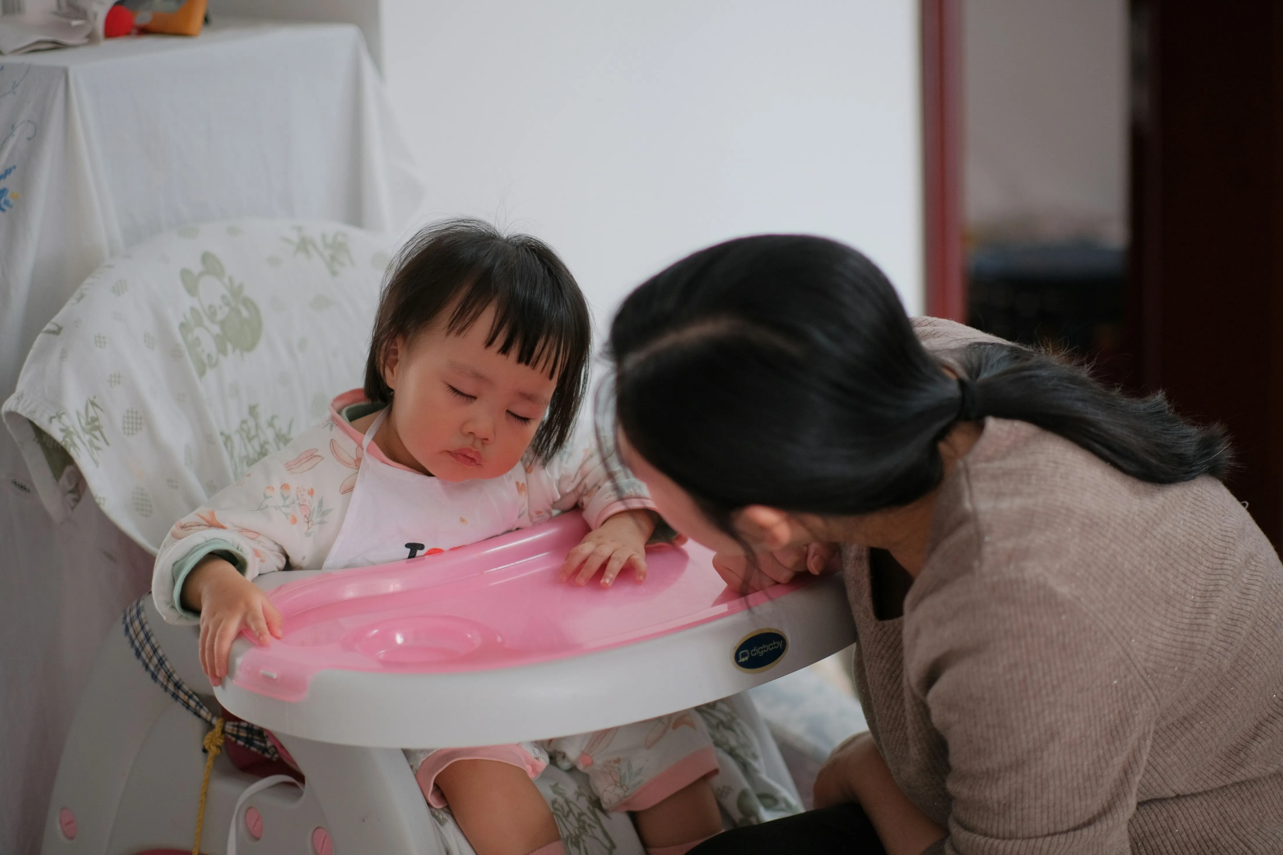 Child Care Provider feeding child